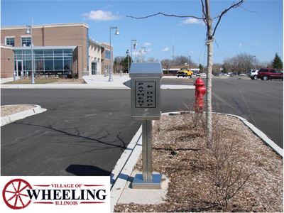 A drop-box in front of a building, with the watermark, "Village of Wheeling, Illinois."
